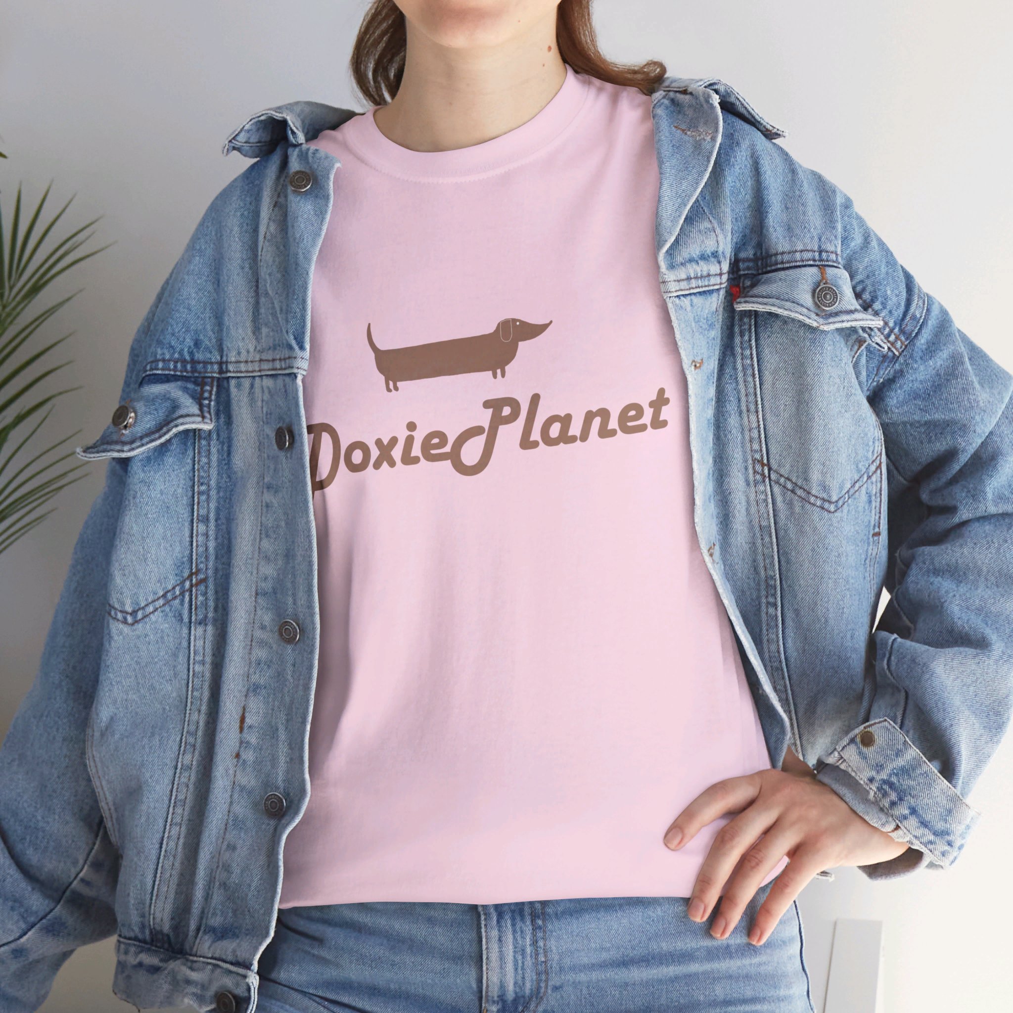 10972853711770728056_2048-1.jpeg | DoxiePlanet A woman in jeans wearing a pink t-shirt that reads DoxiePlanet