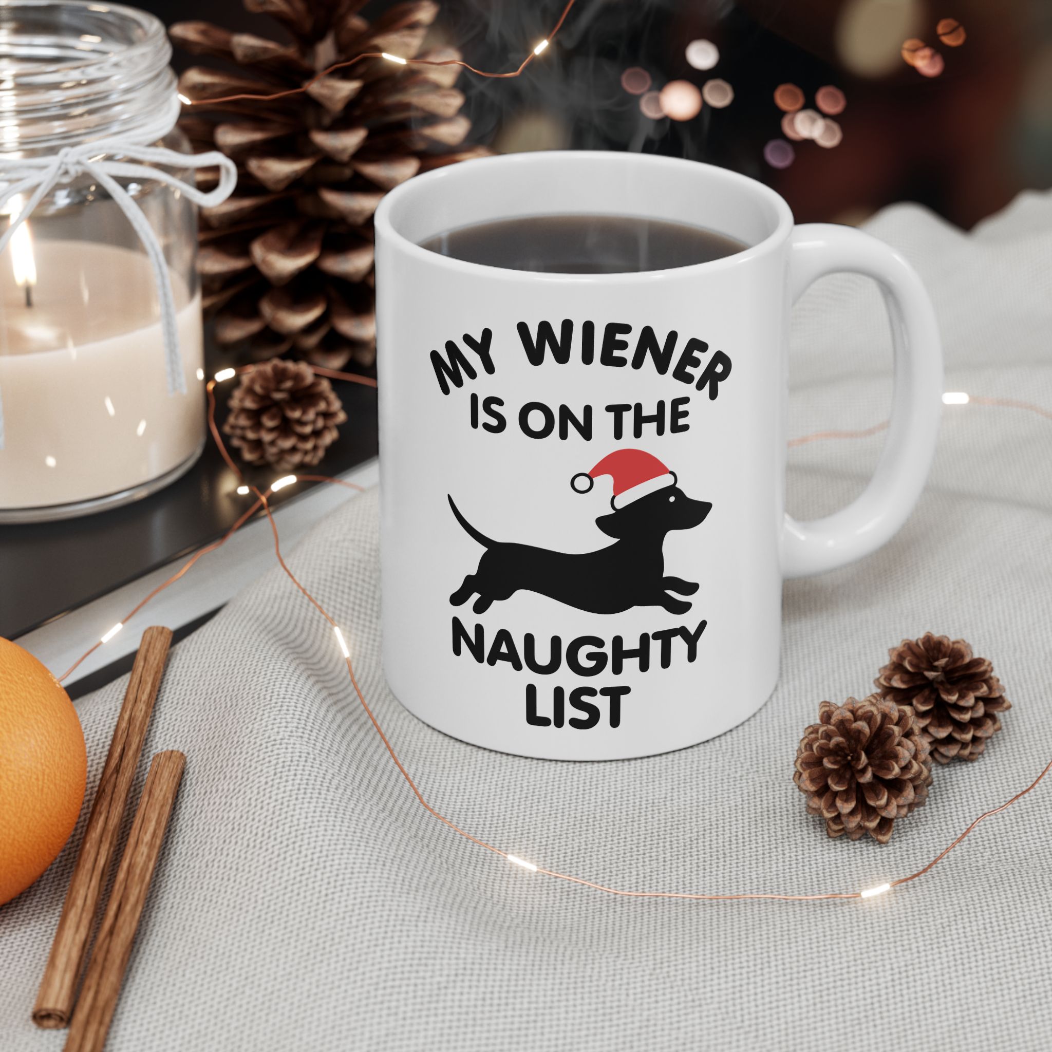 White ceramic holiday mug with Santa-hat Dachshund and “My Wiener Is on the Naughty List” text