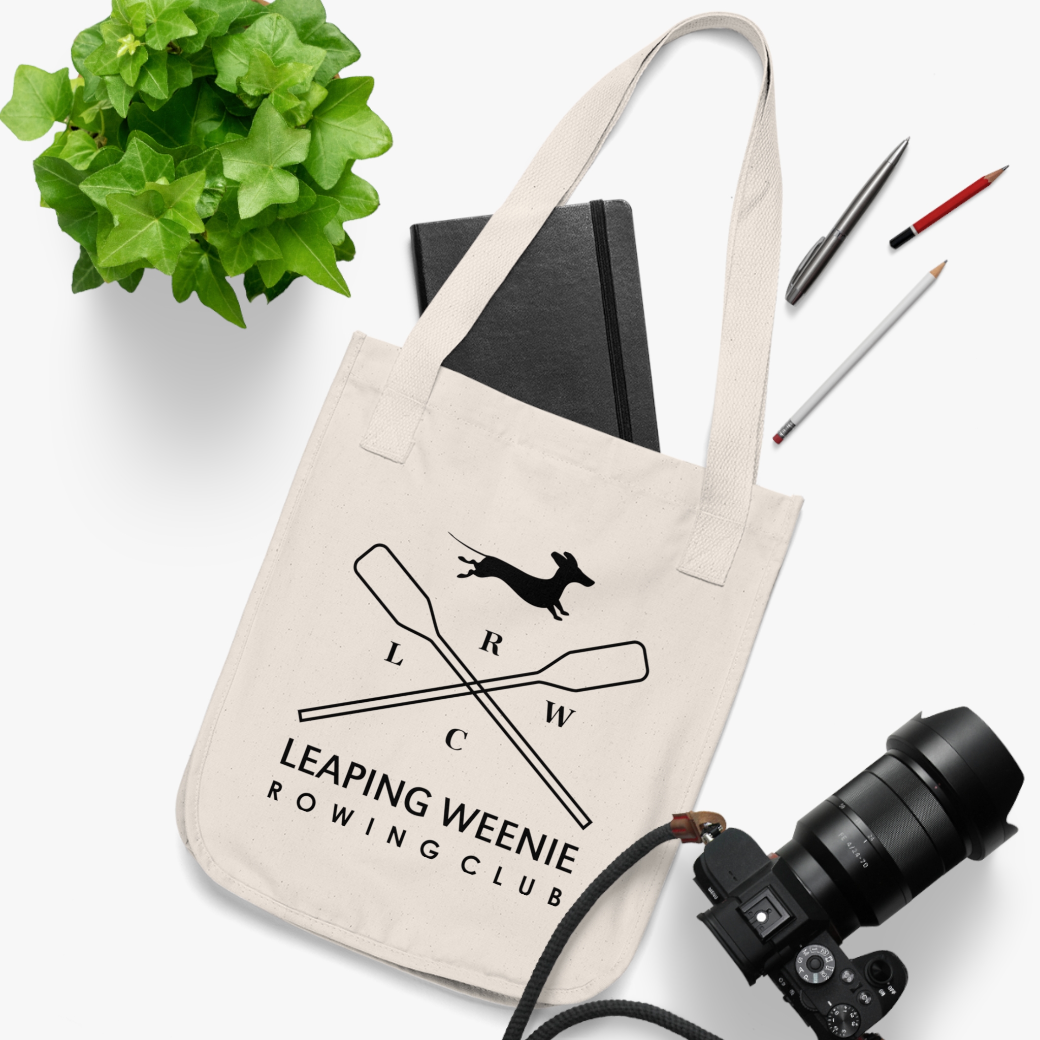 Organic canvas tote bag with Leaping Weenie Rowing Club dachshund mascot logo