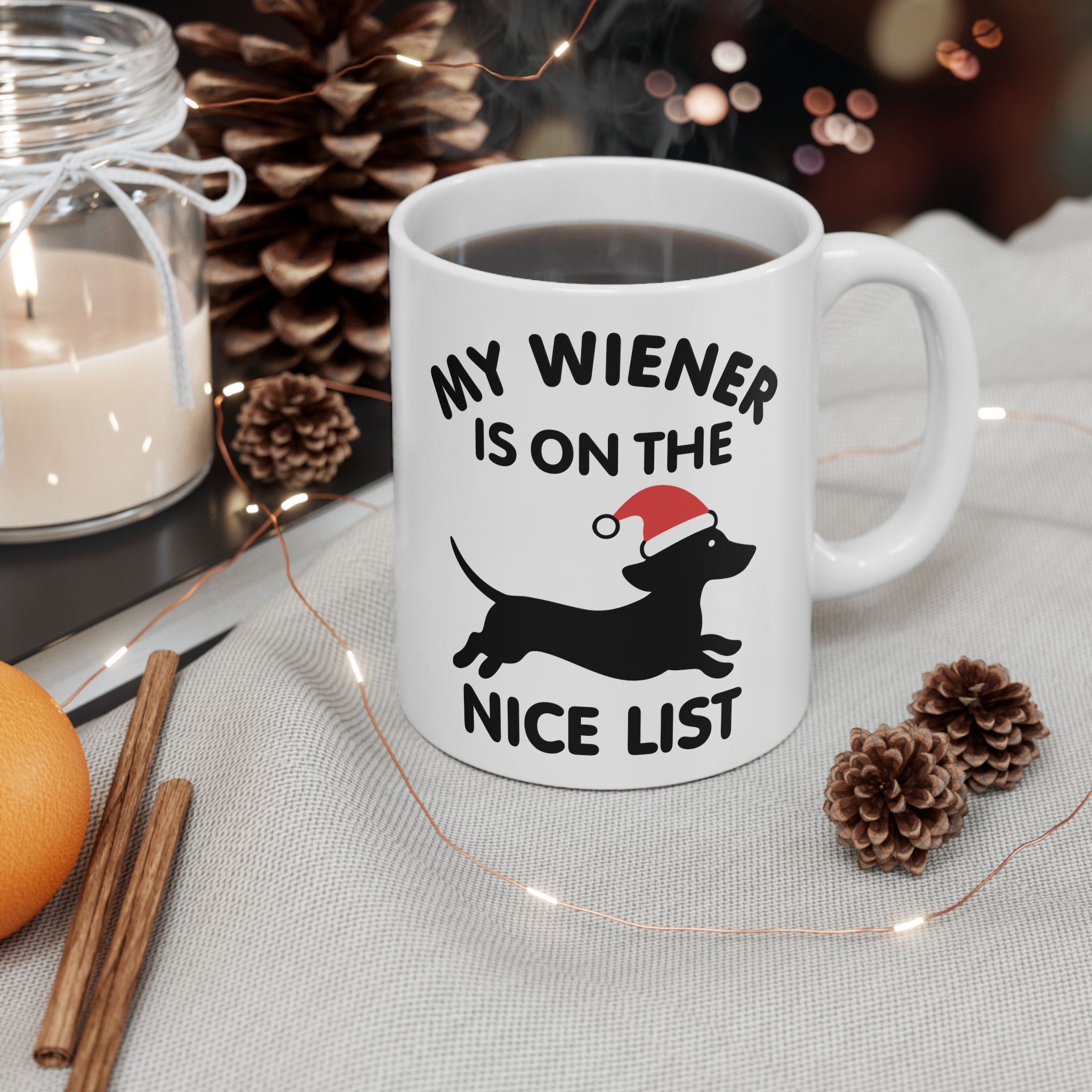 White ceramic holiday mug with Santa-hat Dachshund and “My Wiener Is on the Nice List” quote